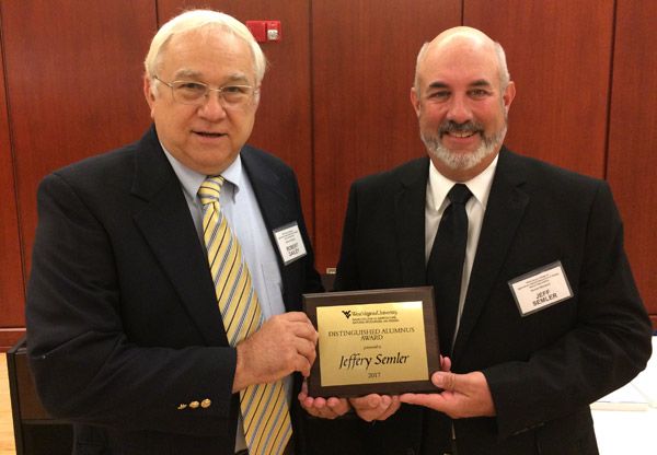 image of Jeff Semler being presented with an award